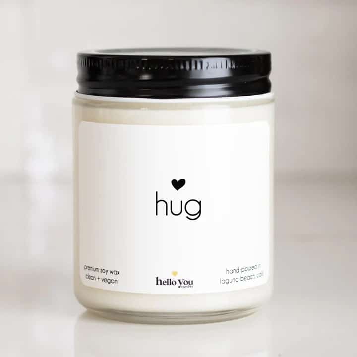 A photo of a candle that reads hug