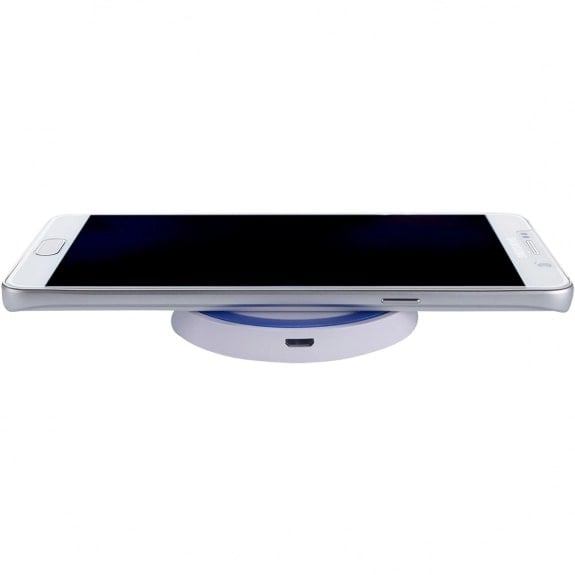 A picture of a white smartphone on a wireless charger